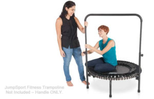 woman installing her handlebar onto her fitness trampoline