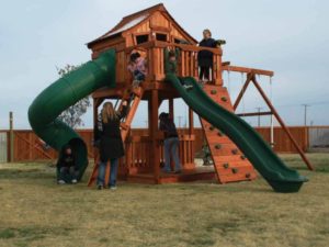 kids playing on their fort stockton playset