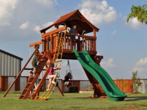 kids playing on their fort ranger playset