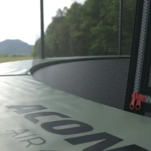 Dark green outer edge of round trampoline, close up, says ACON.