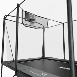 A net around a rectangular trampoline with a basketball hoop, side view.