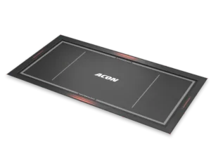 Stylized image of Acon rectangle performance mat shown at a dynamic angle, black and grey says ACON in the middle.
